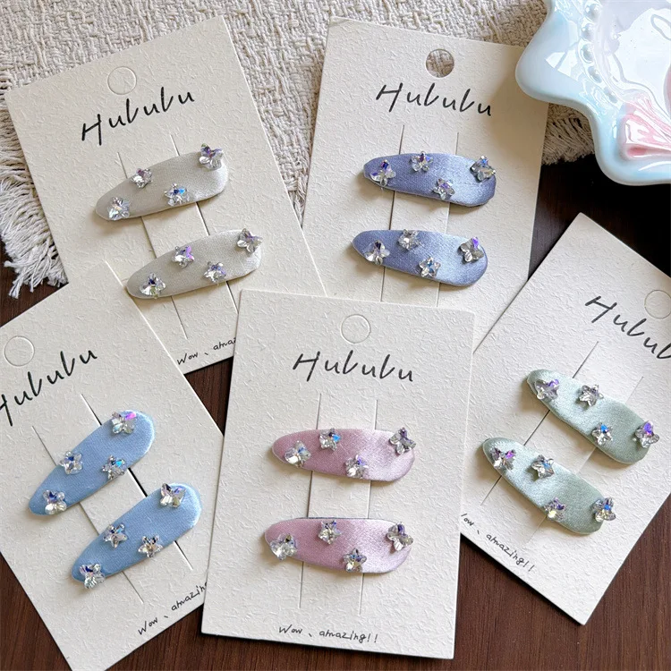 Pinzas laterales con motivo mariposa y estrella