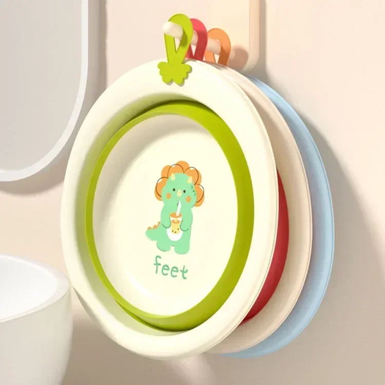 Cubo de lavabo plegable con diseño de dinosaurios visto desde arriba
