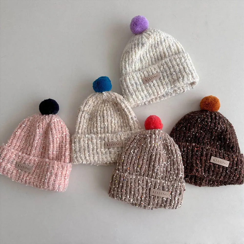 Gorro de invierno copo nieve para bebé con orejeras y pompon rizado