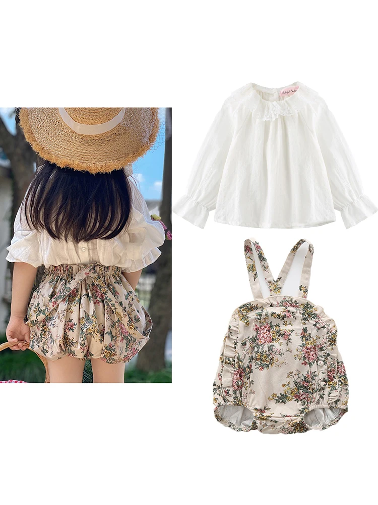Camisa blanca con cuello de muñeca de encaje