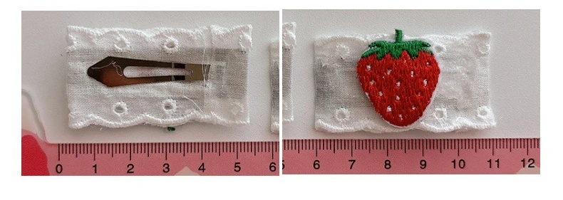 Detalle del clip lateral y el diseño frutal