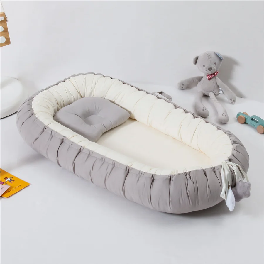 Cuna de viaje portátil con cambiador y almohada integrada