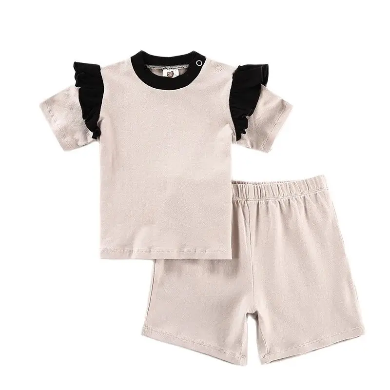 Conjunto bebé top de algodón, pantalón corto con botones y volantes - imagen 5