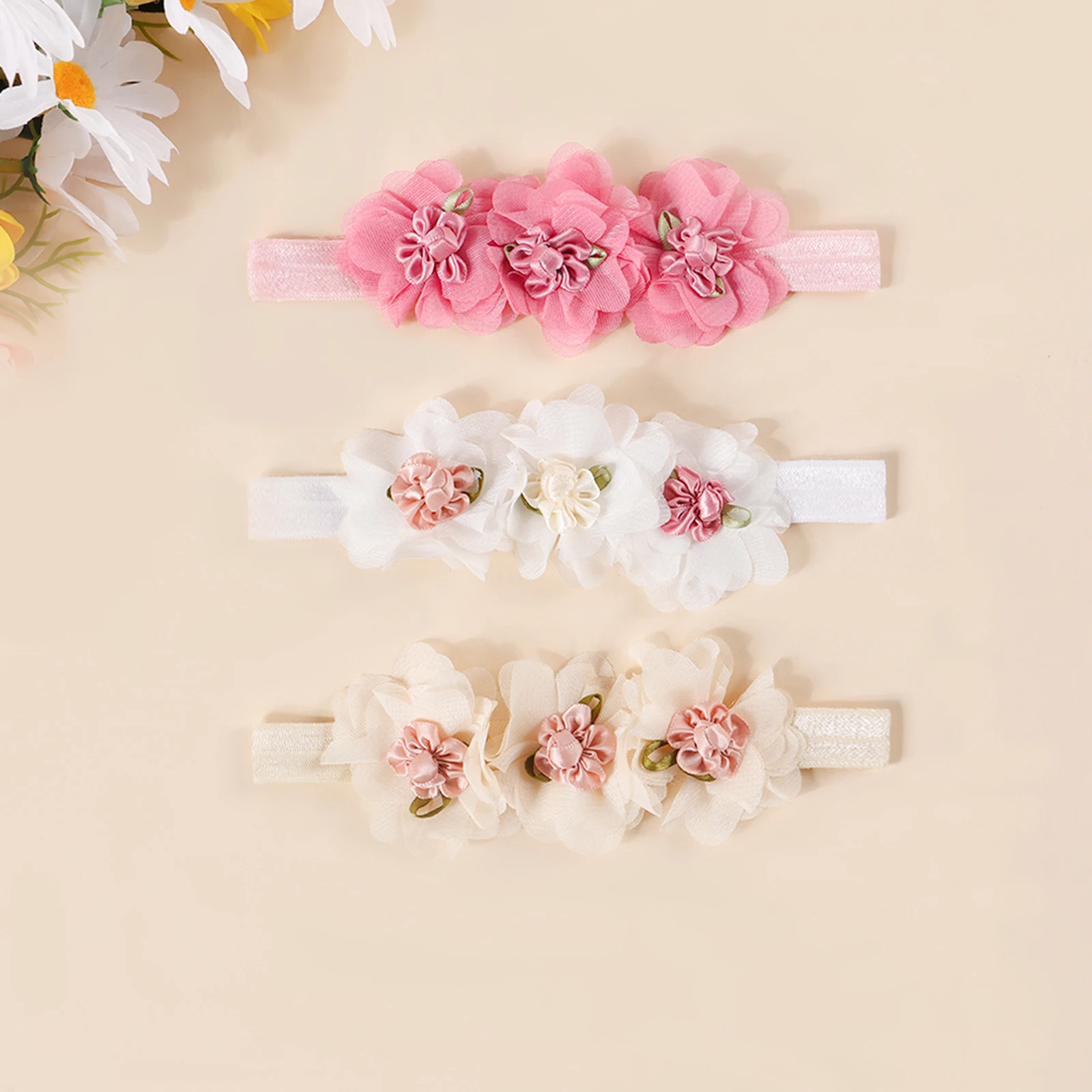 Diadema de nailon suave con flores de gasa