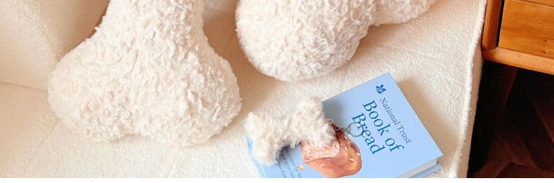 Peluche-hueso tipo almohada, ideal para apoyar