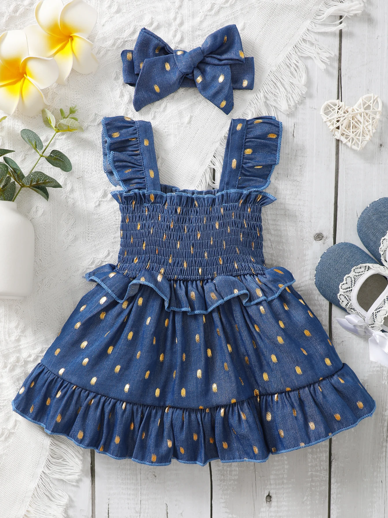 Vestido azul con lunares dorados para niña
