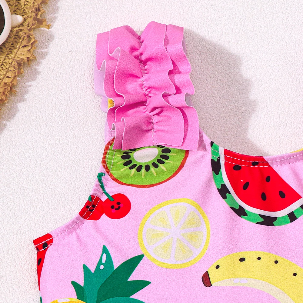 Bañador una pieza niña estampado de frutas con volantes para surf