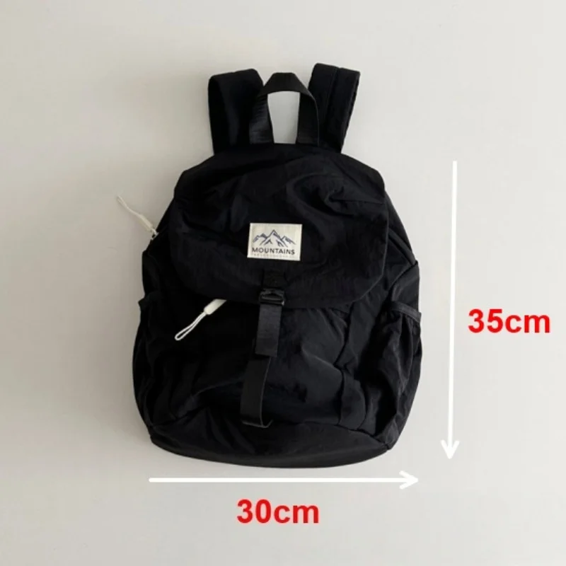 Mochila ligera infantil con tela de secado rápido y bloque de color verde-naranja