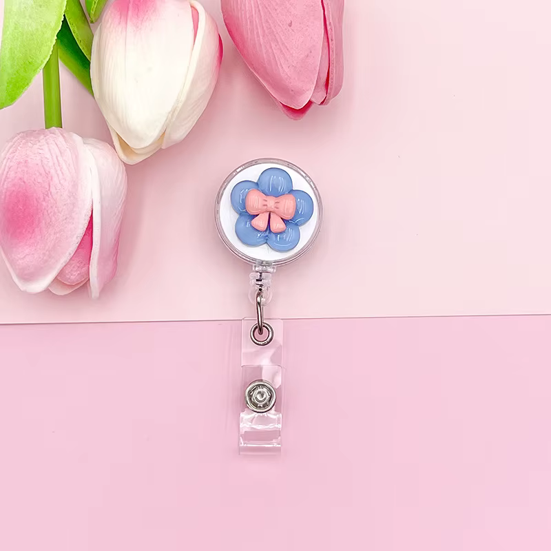 Clip identificativo retractil con nombre para mochila infantil