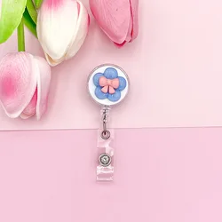 Clip identificativo retractil con nombre para mochila infantil