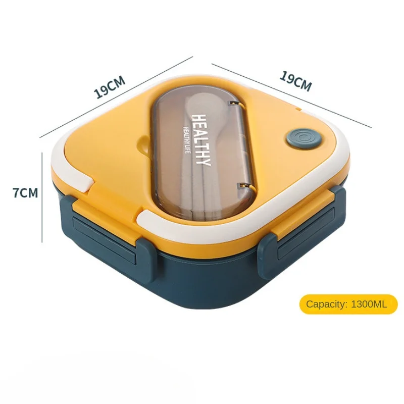 Vista frontal de la caja bento con tapa abierta mostrando los compartimentos