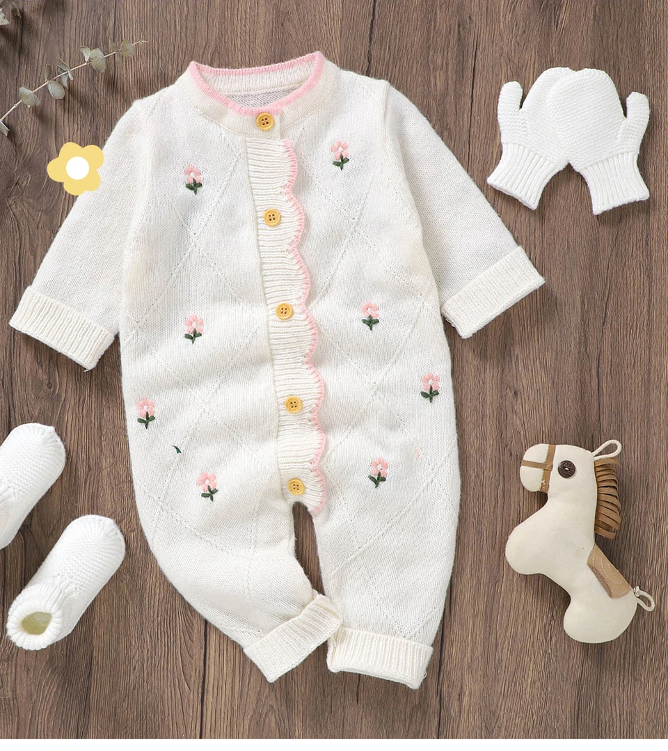 Pelele blanco floral de una pieza para bebé