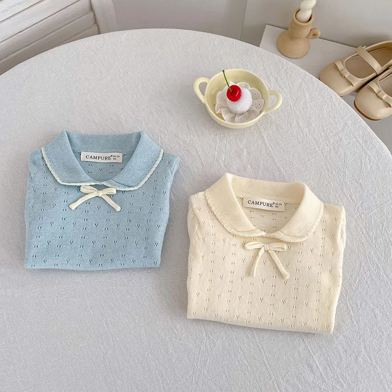 Camiseta niña calada con lazo y tejido ventilado para verano