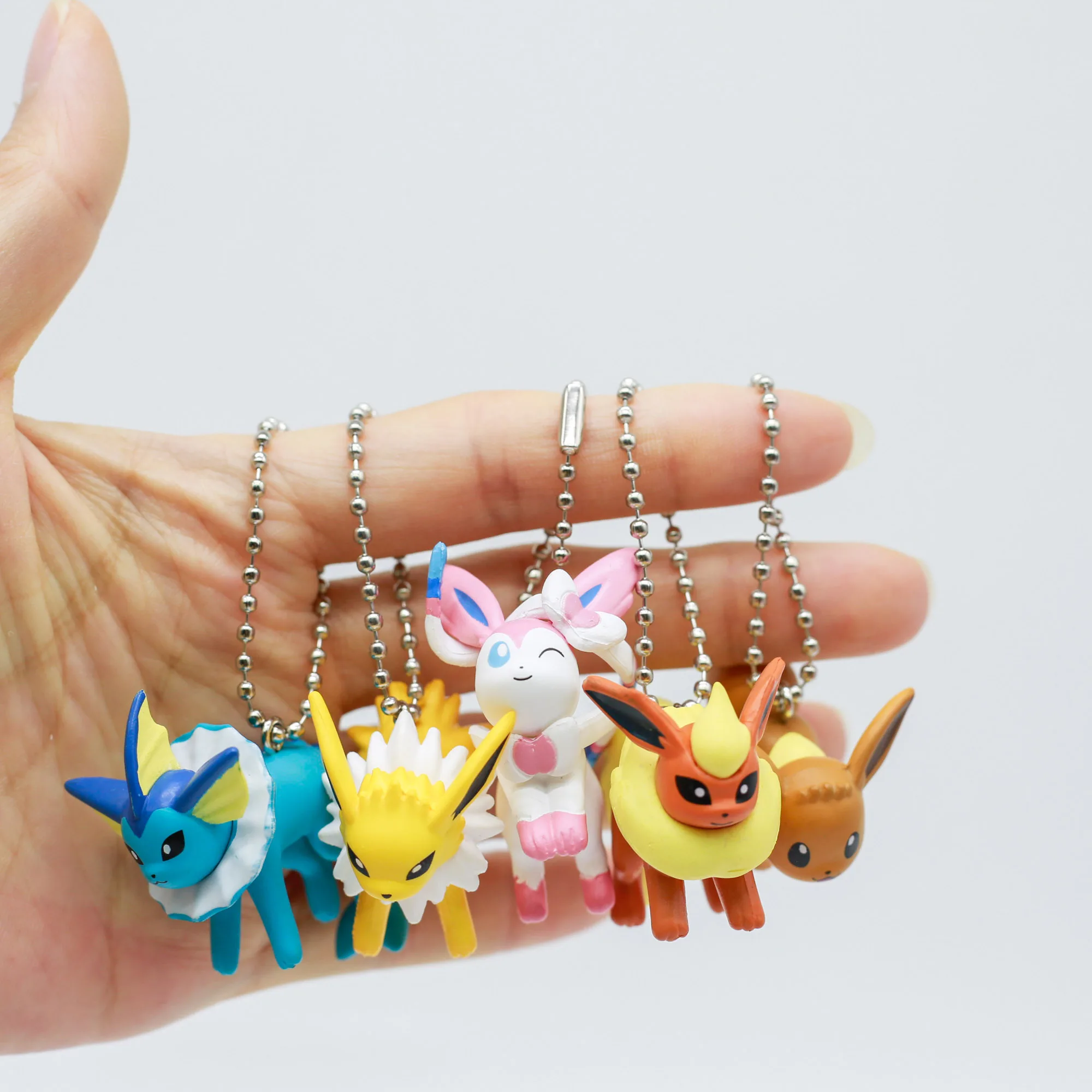 Figura de Pokémon Eevee y evoluciones – Caja sorpresa con llavero - imagen 5