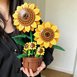 Bloques de construcción con girasol en maceta para armar