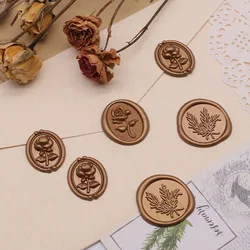 Adhesivos para sellos de cera con acabado oliva en invitaciones