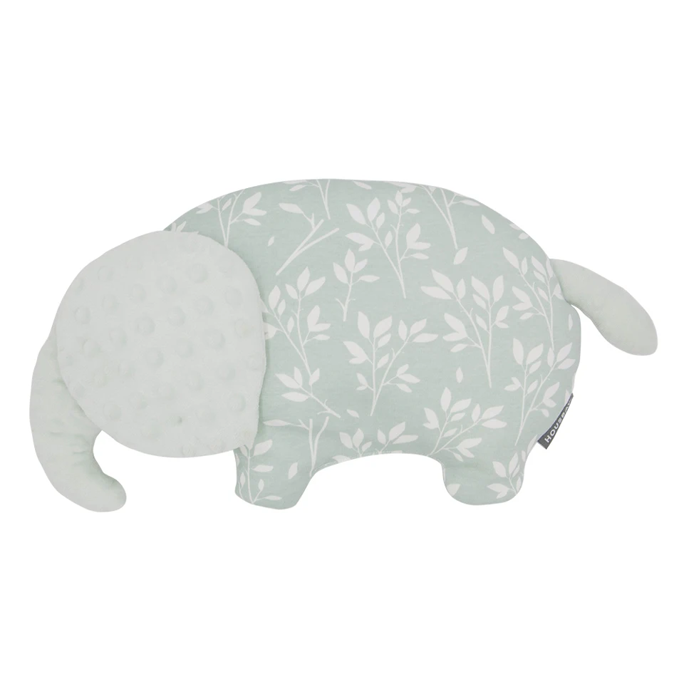 Almohada para bebé colocada en una cuna