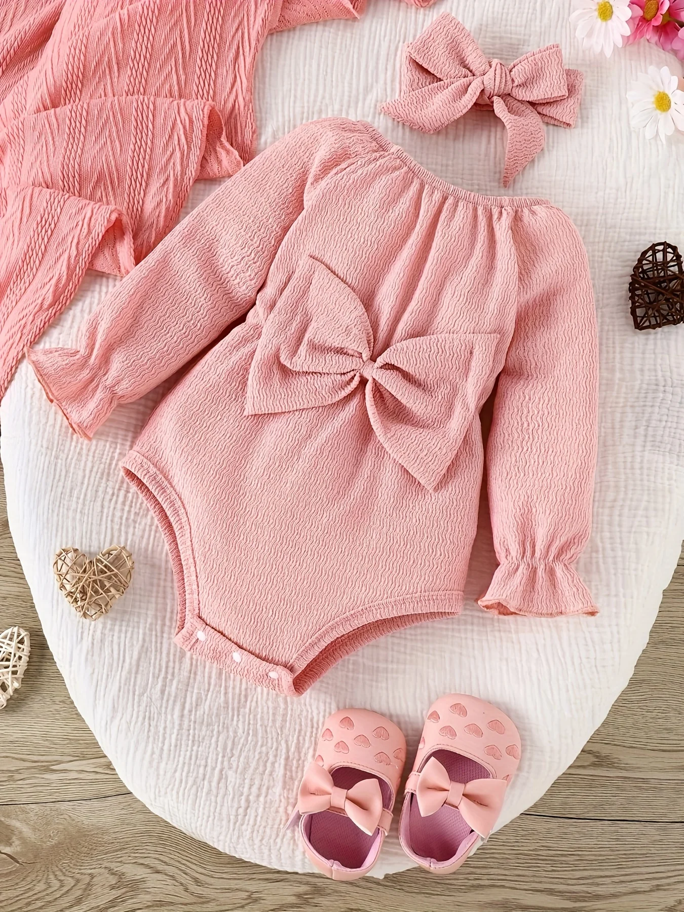 Body manga larga con lazo rosa para bebé