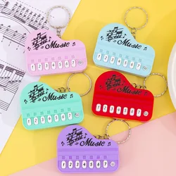 Mini teclado de piano electrónico de juguete llavero musical