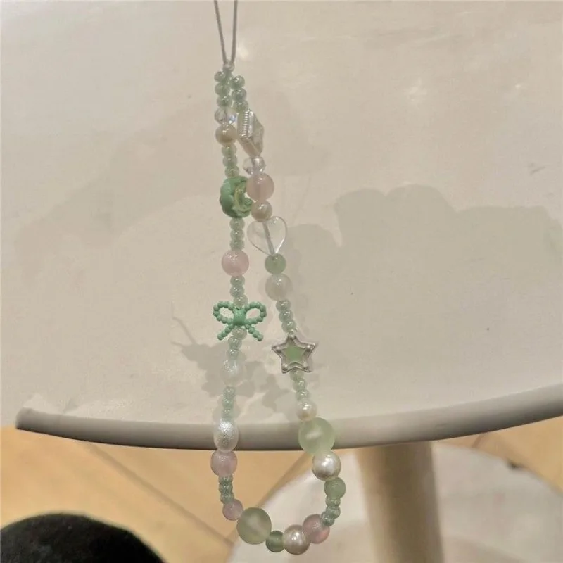 Cadena para móvil niña con lazo de estrella y luna verde – Antipérdida - imagen 2