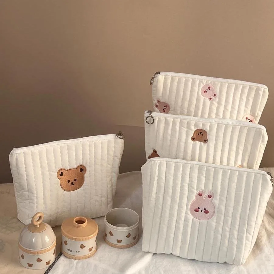 Bolso de mano con bordado de animales y diseño acolchado