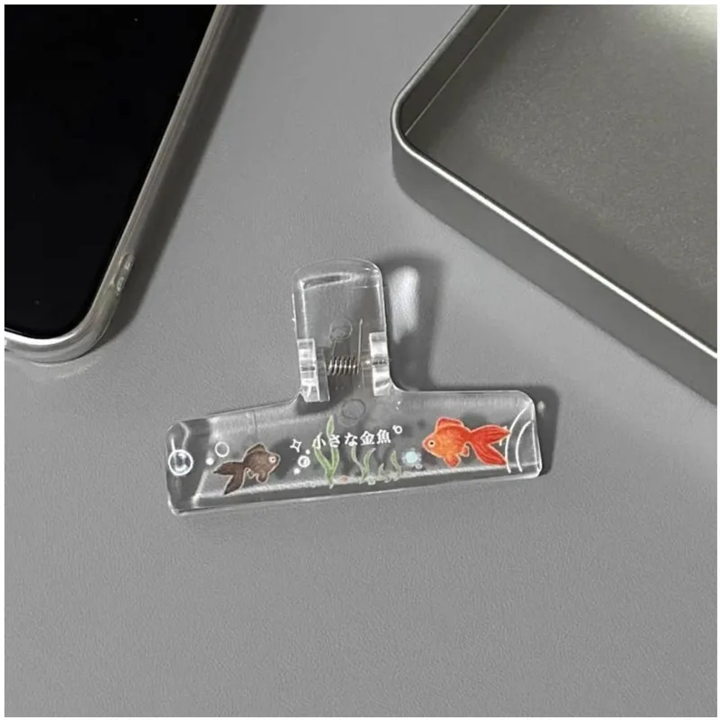Pinza transparente de acrílico para sujetar cuadernos y documentos - imagen 4