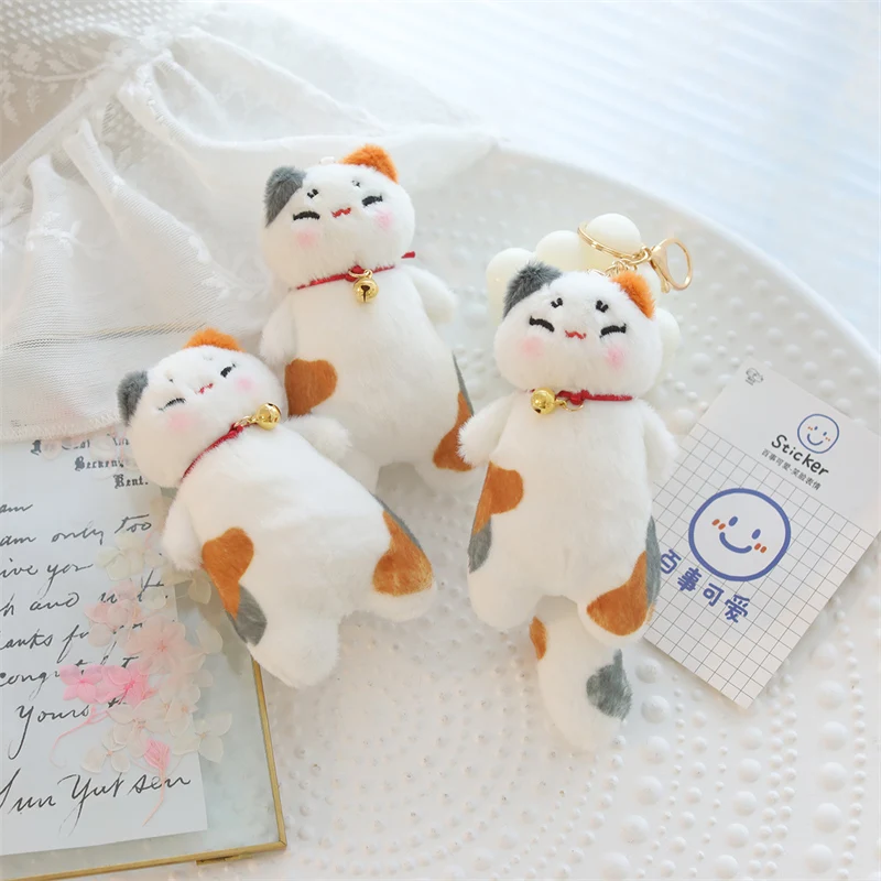 Peluche de gato con flor naranja y campanilla para decorar - imagen 2