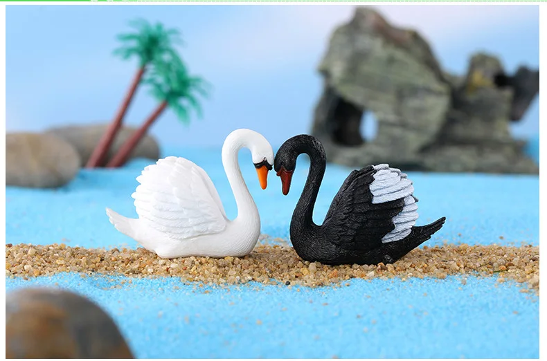 Cisnes en maceta decorativa