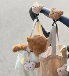 Gancho carrito bebé con figura de oso y bolsa colgante