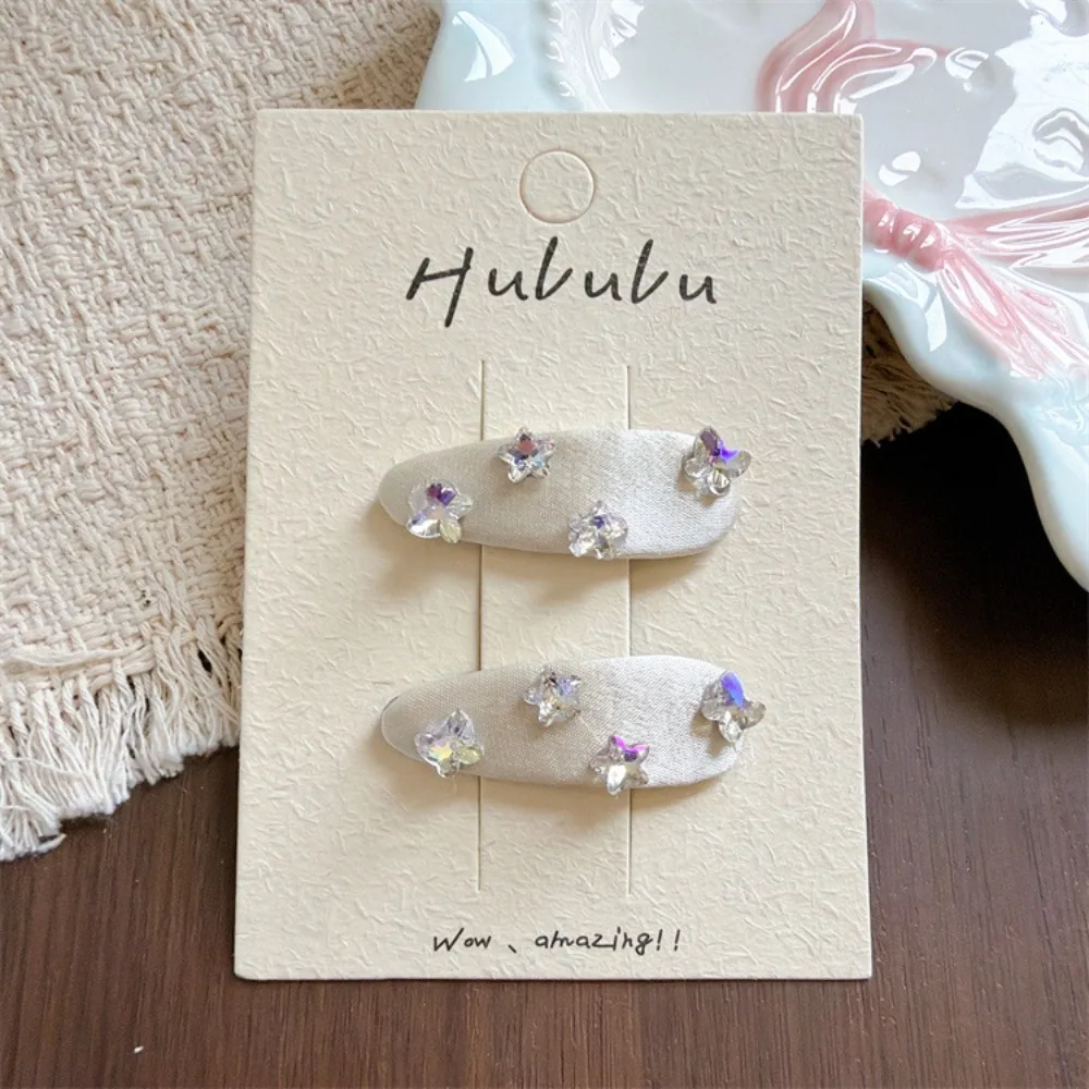 Pinzas para el pelo mariposa y estrella de tela con brillantes - imagen 2