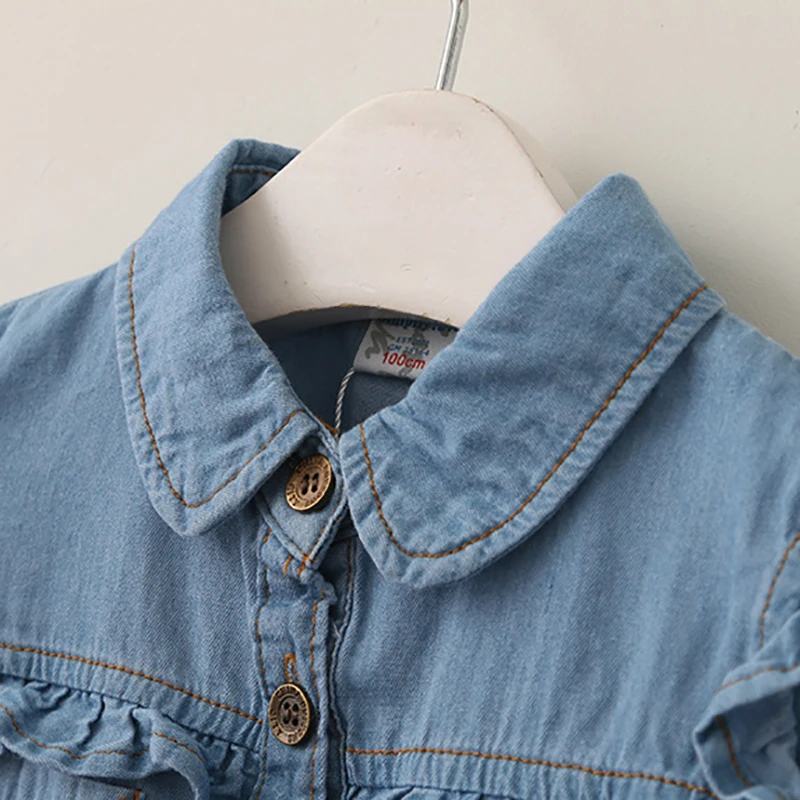 Camisa vaquera de niña con volantes y nudo, manga larga