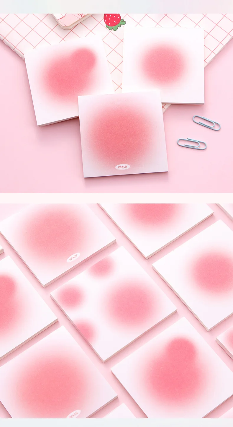 Bloc de notas adhesivas kawaii abierto mostrando hojas con diferentes diseños