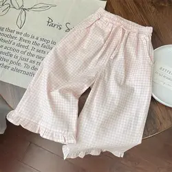 Conjunto infantil blanco-rosa con lazo: top y pantalón a cuadros