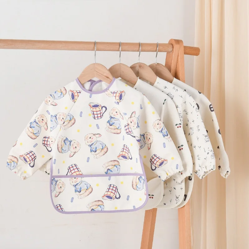 Delantal impermeable para bebé con capucha y funda de comida - imagen 2
