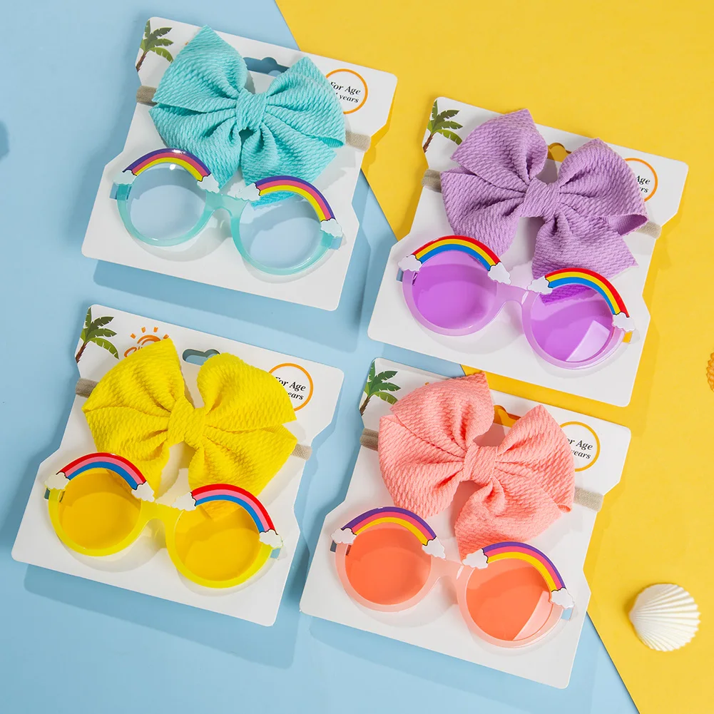 Set de gafas de sol arco iris y gomas elásticas para bebé