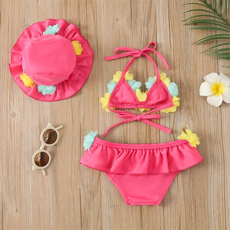 Traje de baño niña con flores, bikini halter y gorro de playa - imagen 3