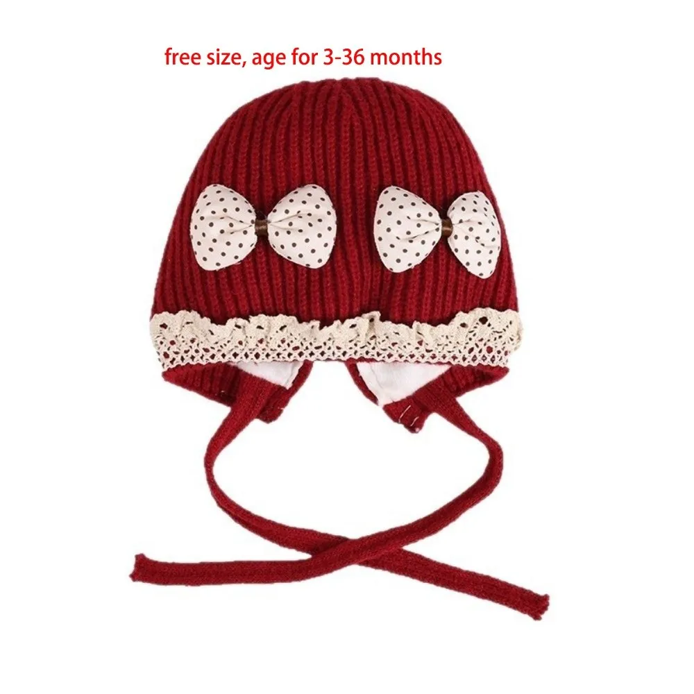 Gorro tejido azul con pompón para bebé