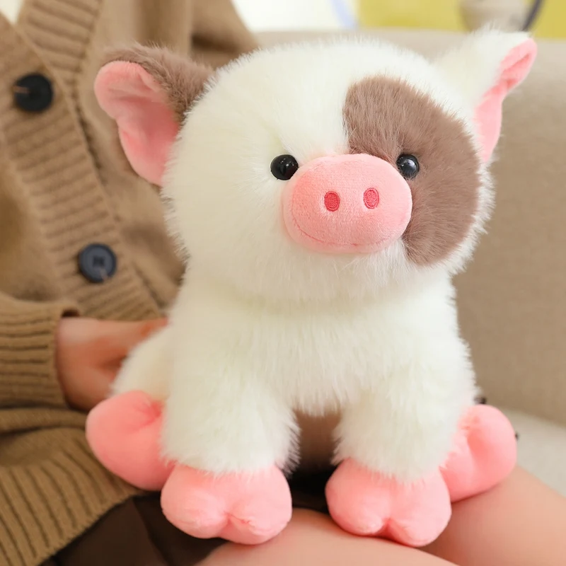 Mini cerdito de peluche con taza de té blanca