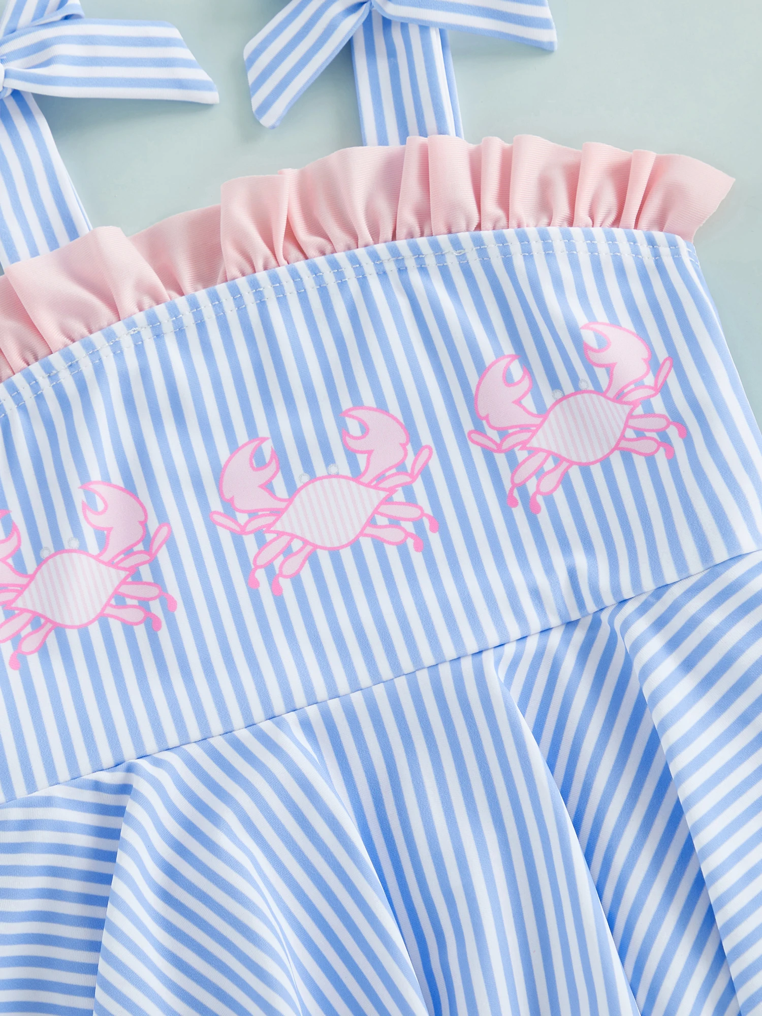 Traje de baño infantil azul con lazo para verano