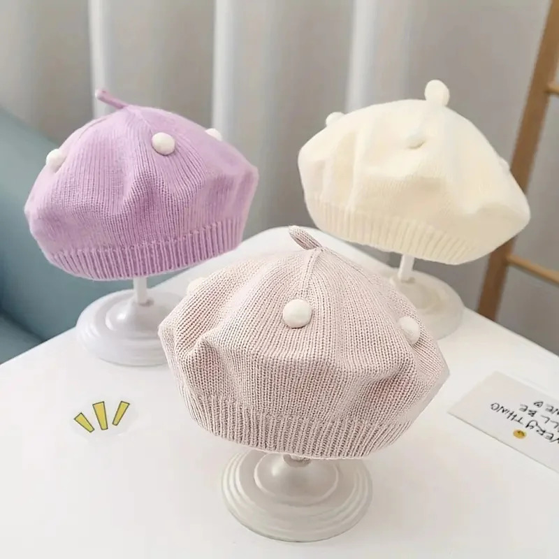 Gorra boina de bebé con tejido elástico y detalle decorativo