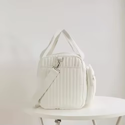 Bolsa de pañales rayada con ventana transparente y parche oso