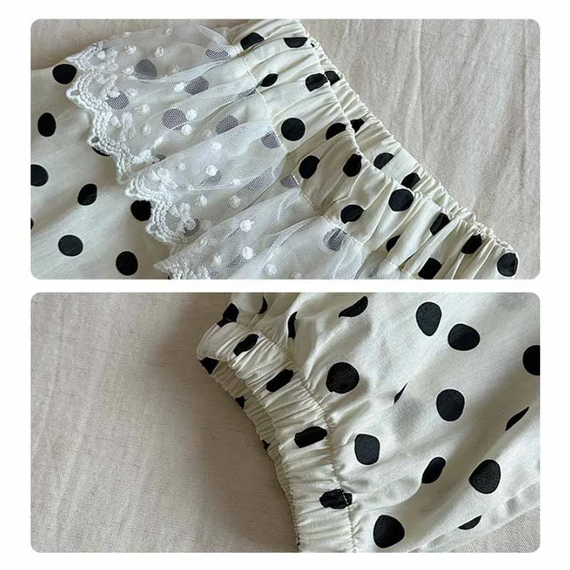 Detalle de encaje y lazo en cintura de pantalones infantiles