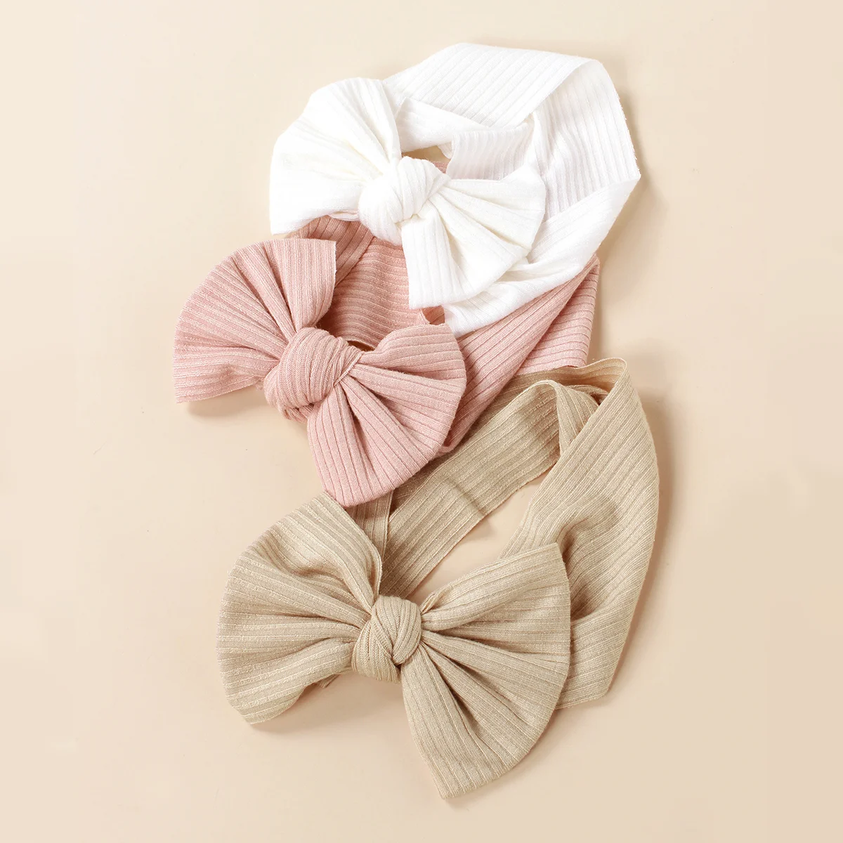Diadema tejida para bebés con lazo de colores y estilo deportivo