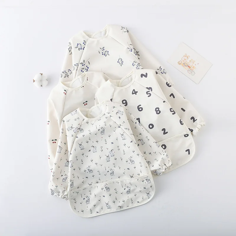 Delantal impermeable para bebé con capucha y funda de comida - imagen 3