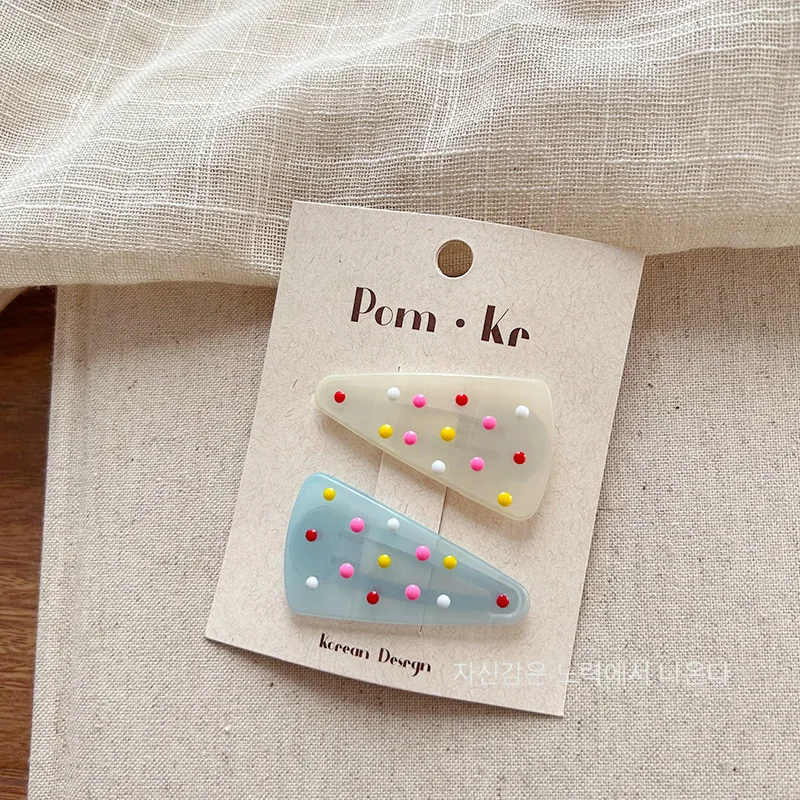 Pinzas triangulares de gelatina pastel con lunares para niños - imagen 2