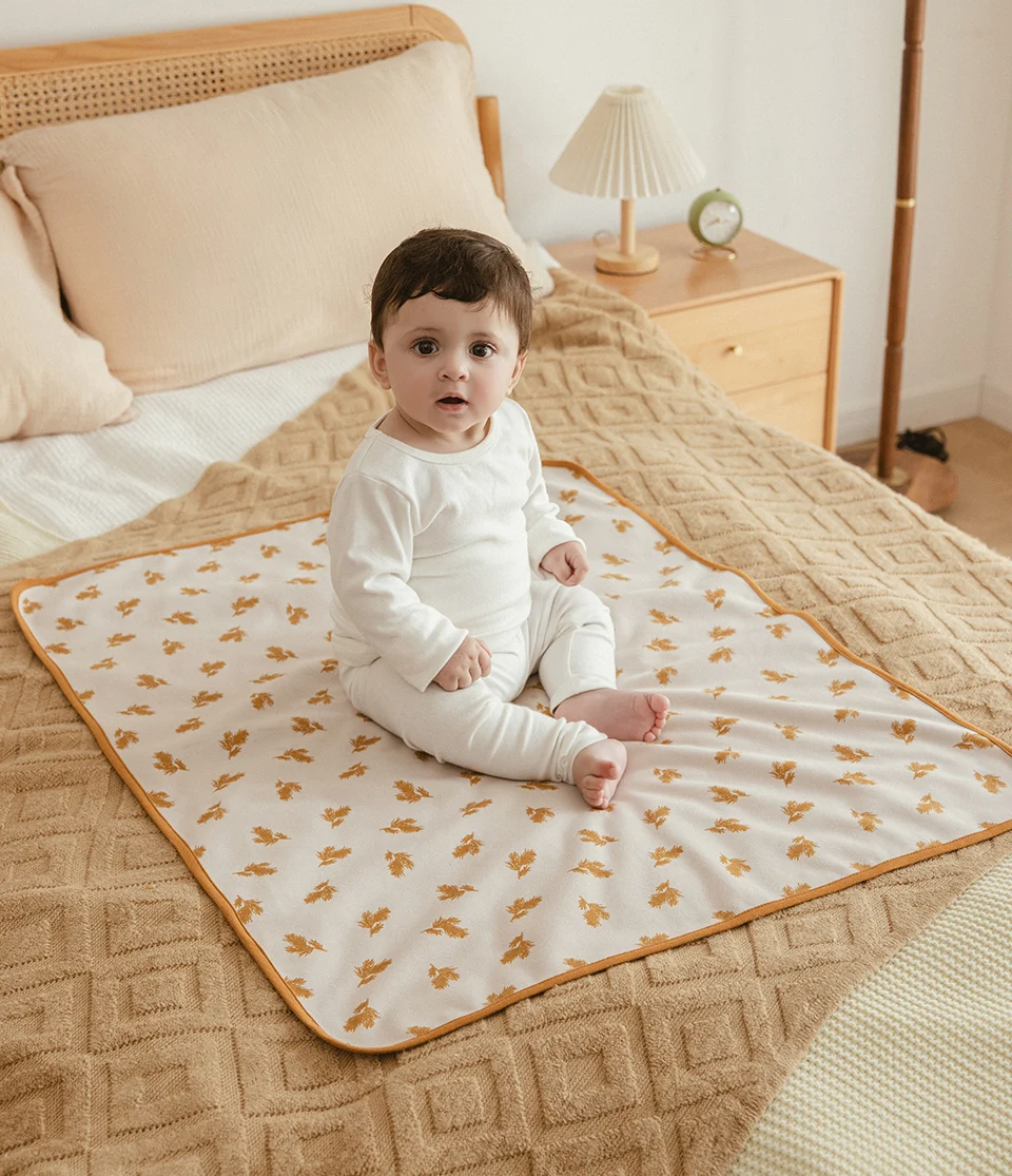 Superficie absorbente y capa impermeable del cambiador