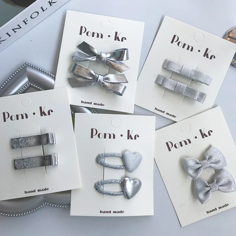 Pinzas de pelo cocodrilo con lazo plateado para bebés - imagen 2