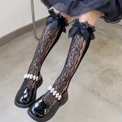 Calcetines largos con encaje y volantes para niña