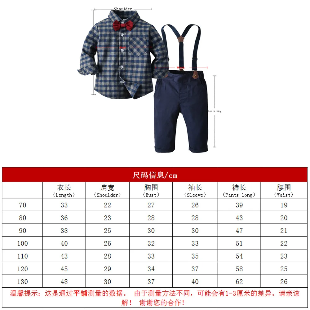 Niño con conjunto completo de camisa a cuadros y pajarita