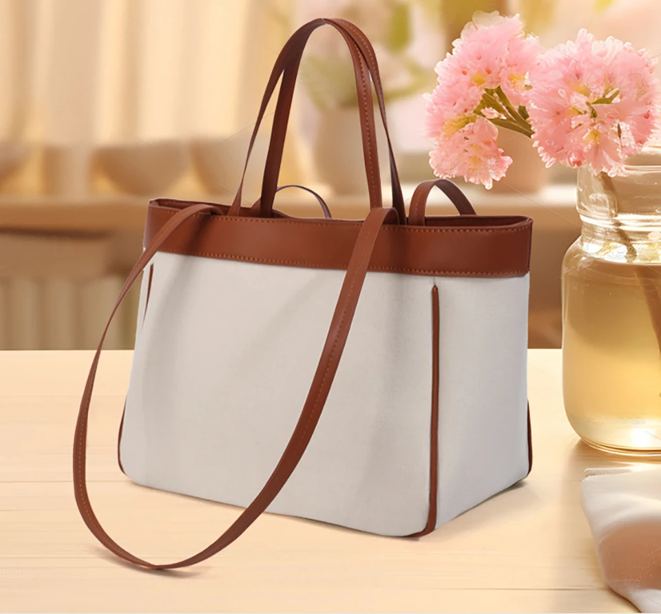 Bolsa de pañales de moda en contraste marrón y blanco